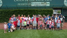 Pediatric patients play catch at Wrigley Field