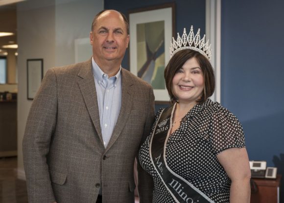 Wendy Roach, Miss Illinois Plus America and director of patient access at Advocate Good Shepherd Hospital in Barrington, poses with Advocate President and CEO Jim Skogsbergh.