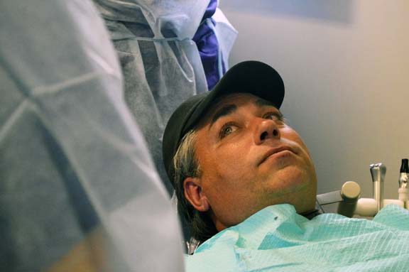 Robert Knapczyk listens to his dentist’s advice prior to his treatment.