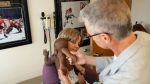 Dr. John Rugge examines baby Dominique before her surgery at Advocate Children's Hospital.