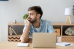 A man easily distracted during work.