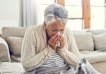 A woman with a chronic health condition is sick with the flu.