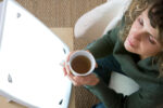 Woman using light therapy box