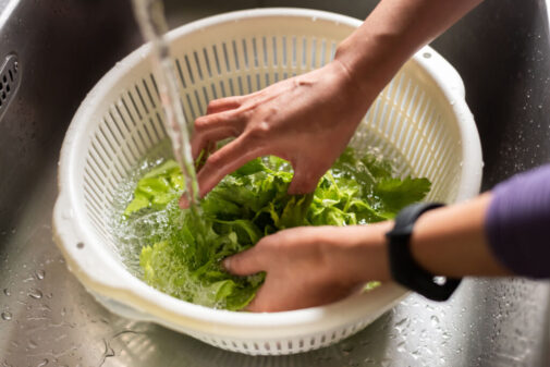 How should you wash fruits and vegetables?
