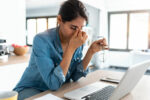 A woman has prolonged stress which can impact her thyroid health.