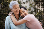 A woman finding happiness after surviving cancer and learning after cancer care.