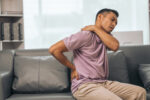 A man has chronic pain in his back and neck.
