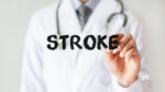 Doctor writing the word stroke