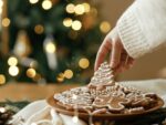 A woman's hand is grabbing an indulgent holiday treat, christmas cookie