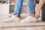 A person putting on shoes.
