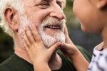 A grandparent reaping the health benefits of spending time with their grandchildren.