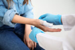A woman goes to the emergency room for a cut.
