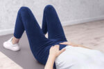A woman with uterine prolapse feels pressure on her pelvic floor.