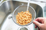 A man rinses beans before eating them in hopes to lose weight.