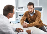 A doctor explaining gallstones and bile duct cancer to patient.