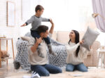 Family staying active inside their house during winter.