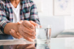 A man has Parkinson’s disease symptoms, like shaky hands.