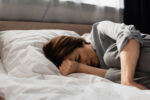 A woman, who is at an inceased risk for migraines, has severe head pain.