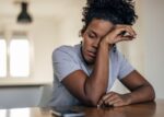 A woman has fatigue from long COVID.