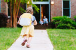 A child after school going home to spend time with parent and family.