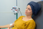 A cancer patient does cold capping to preserve her hair during chemotherapy treatment.
