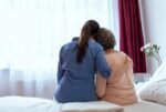 A caregiver and a loved one with Alzheimer's disease.