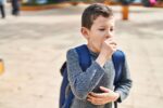 A child has whooping cough sickness.