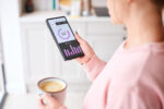 A woman tracking her sleep with smart technology device.