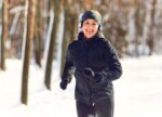 A woman exercising in the cold. Special precautions need to be taken to protect your lungs.