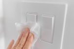 Disinfecting high touch points in the house after illness.