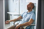 A man receiving chemotherapy which is one cancer therapy option.