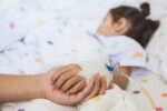 A child in the hospital to prevent flu related death.