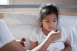 A child has a chronic cough and is taking cough syrup.