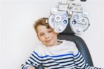 A child has nearsightedness and is getting an eye exam.