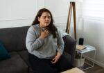 A woman having panic attack symptoms.