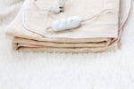 Heat therapy for sore muscles using a heating pack.