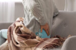 A man has chronic pain symptoms because of the cold winter weather.