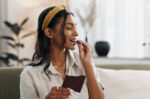 A woman eating dark chocolate which studies show reduces risk of diabetes.