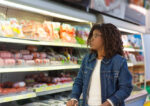 A woman avoiding certain foods to keep her colon healthy.