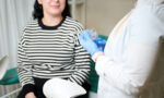 A woman and a gynecologist at a gynecology appointment.
