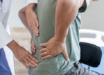 A man seeks treatment for lower back pain.