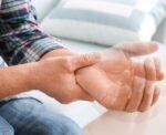 A man has early signs of ALS which includes shaky hands.