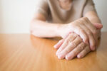 A person has a health condition that causes shaky hands.