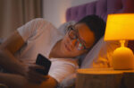 A man has light sources affecting his sleep.