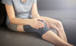 A woman following the PEACE and LOVE injury protocol.