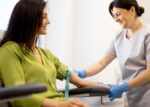 A nurse drawing a patient's blood for bloodwork, blood test.